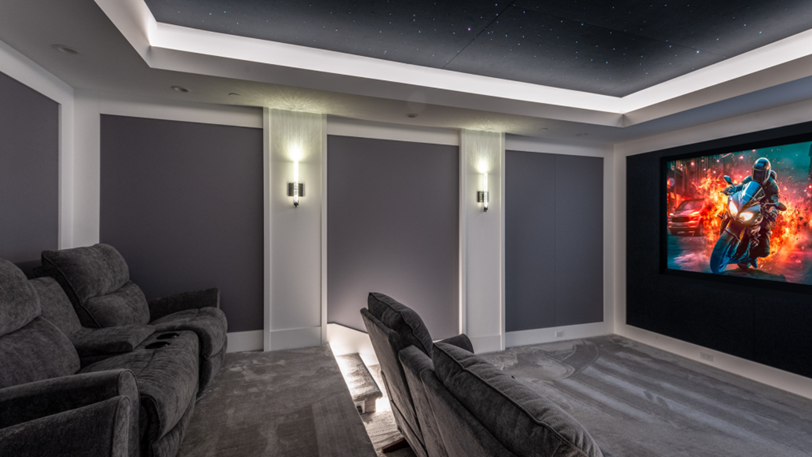 A newly installed home theater with plush seating and embedded lighting.