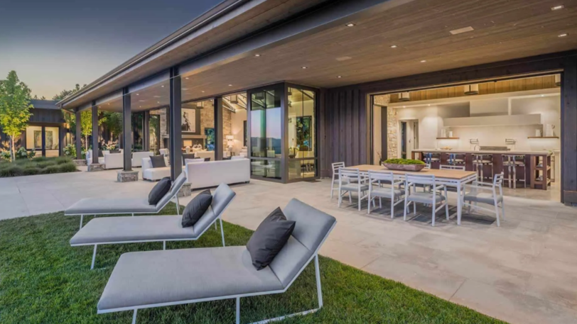A modern home with an outdoor space enhanced with professional AV installations.