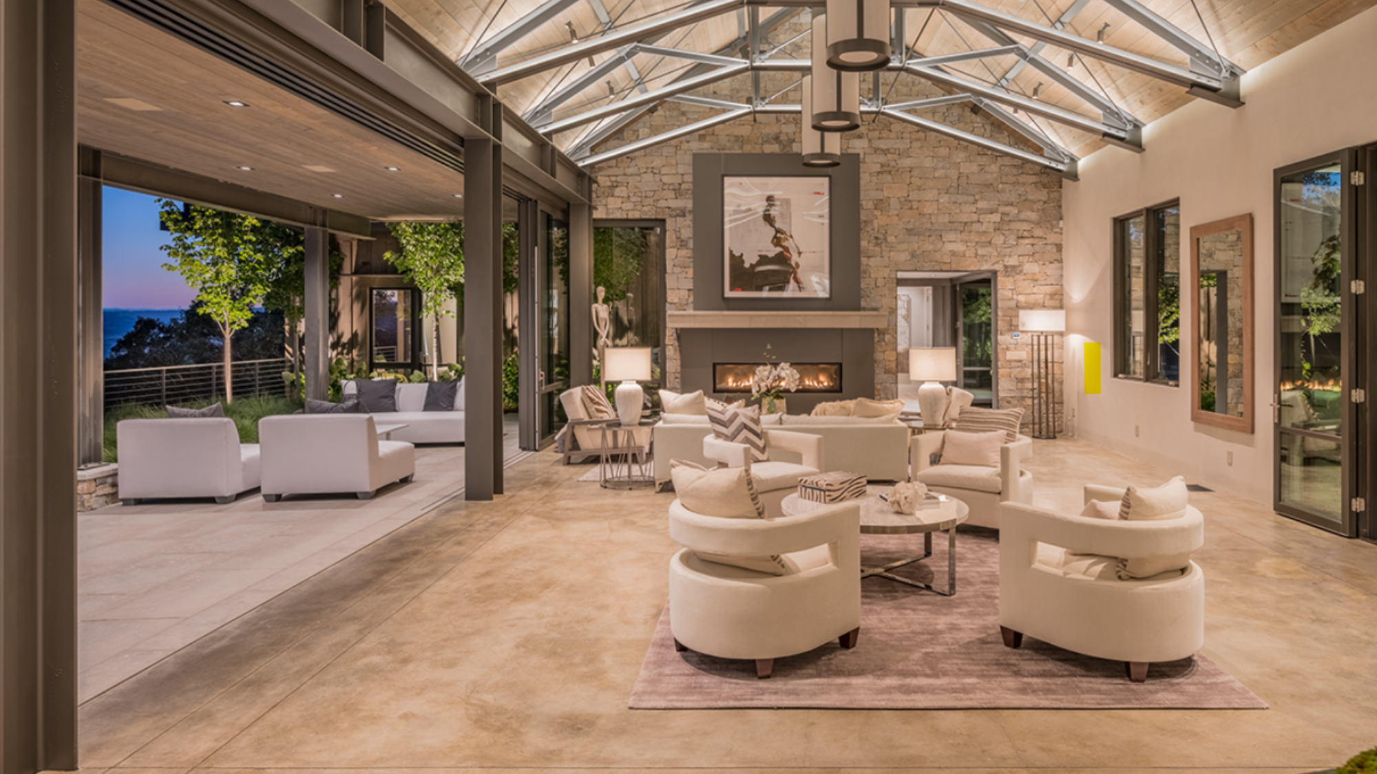 A large open living area in a modern home with beautifully integrated home tech.
