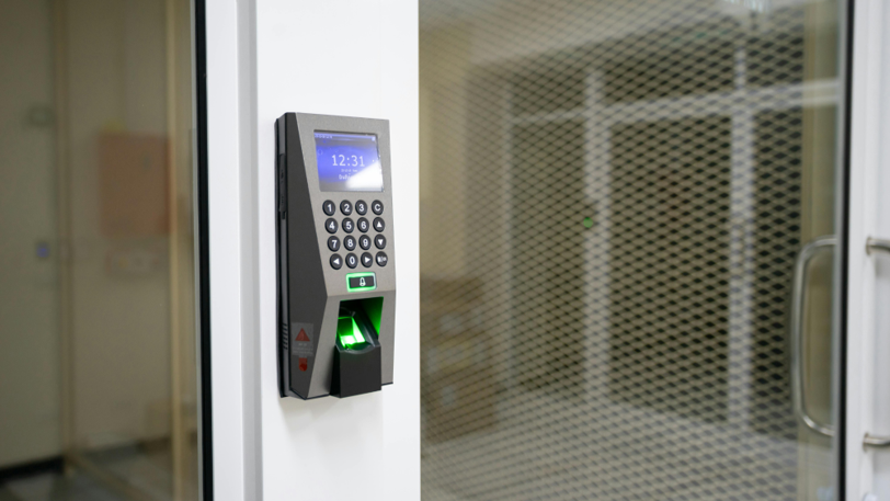 A modern door security system with a number pad and ID scanning technology.